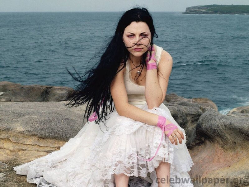 woman in white dress by the sea