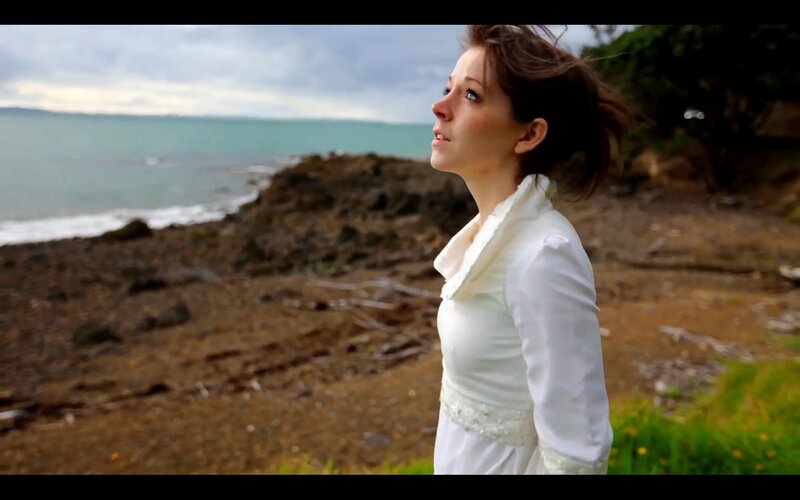 woman in white dress by the sea