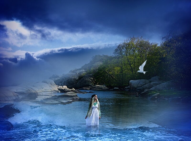 woman in white dress by the water