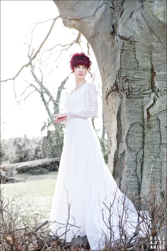 Woman in white dress by tree