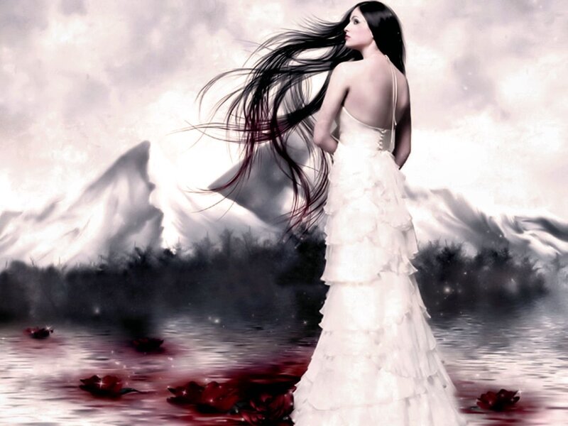 Woman in white dress by water