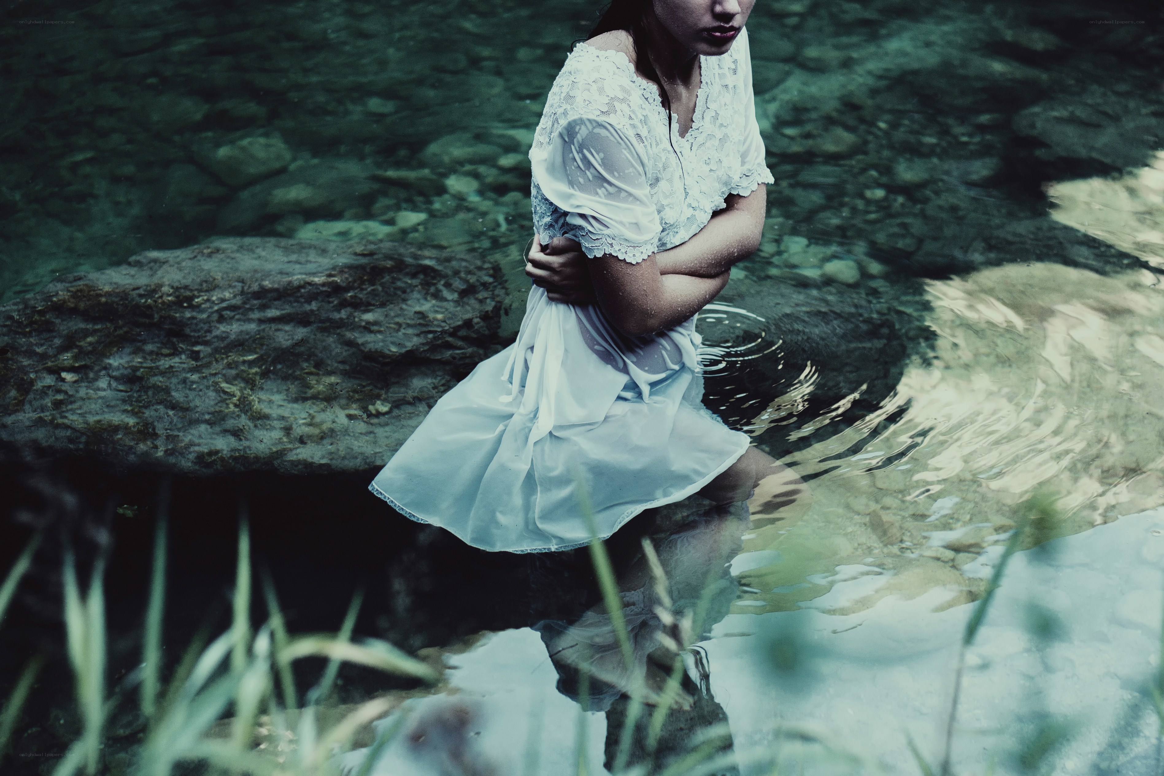 woman in white dress by water