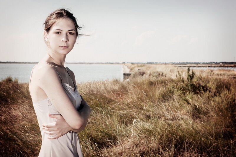 woman in white dress by water
