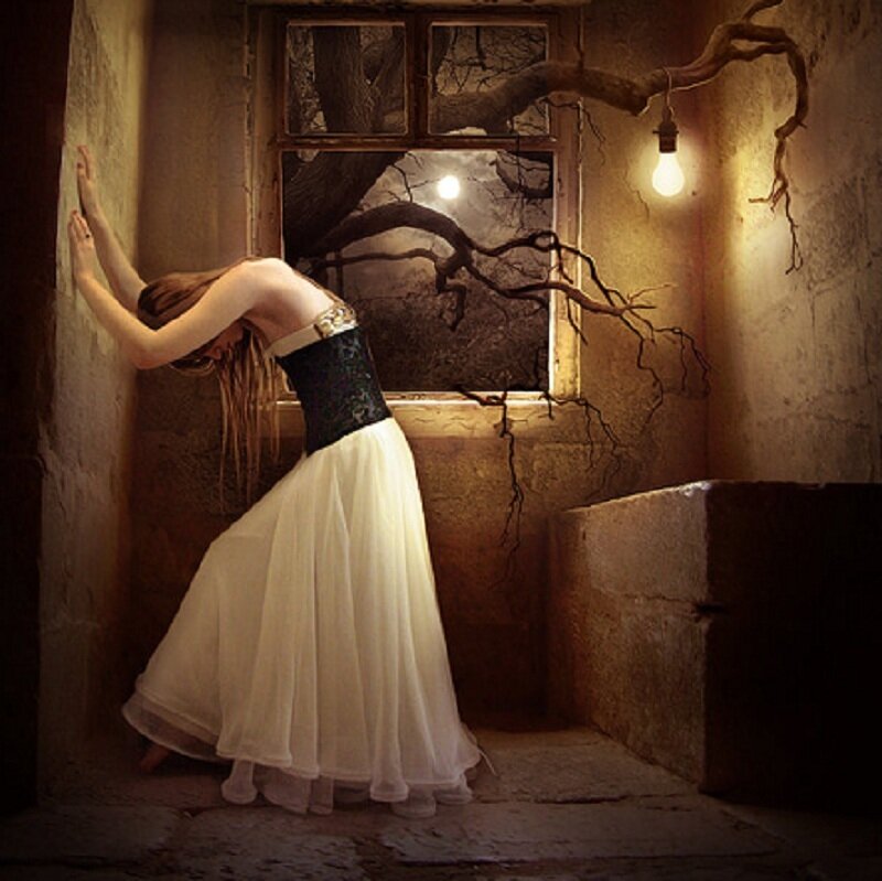 woman in white dress by window