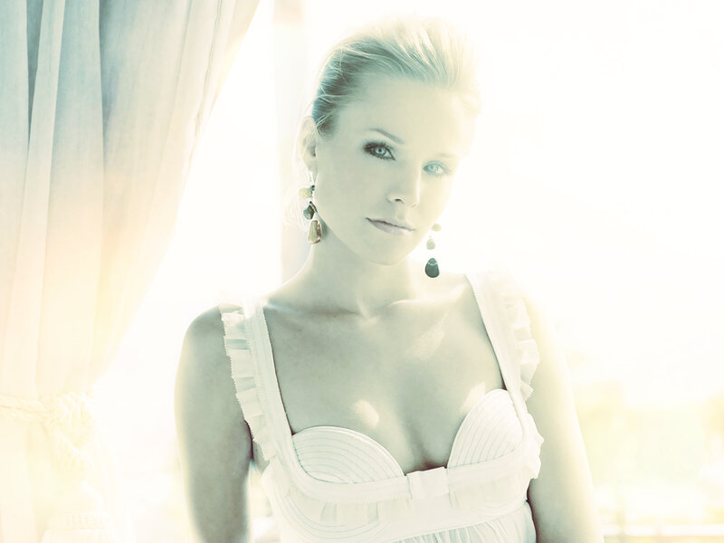 woman in white dress by window