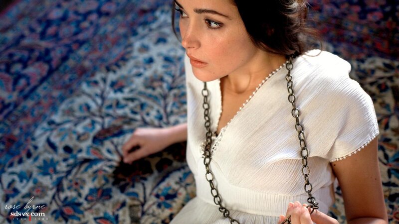 Woman in White Dress — Contemplative, Photograph, Chain Necklace, Patterned Rug, White Dress