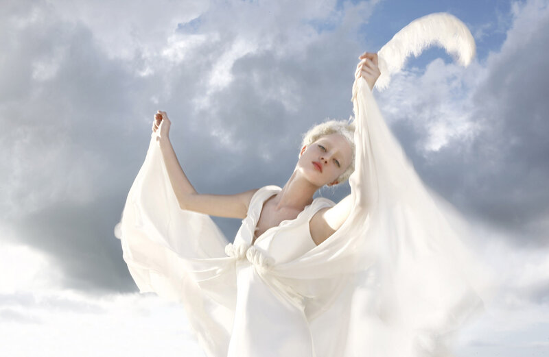 Woman in White Dress — Dramatic, Afternoon, Photograph, Clouds