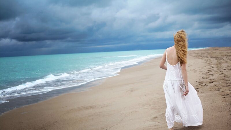 Woman in White Dress — Dramatic, Photograph, Beach, Ocean, Clouds, Blue, Brown
