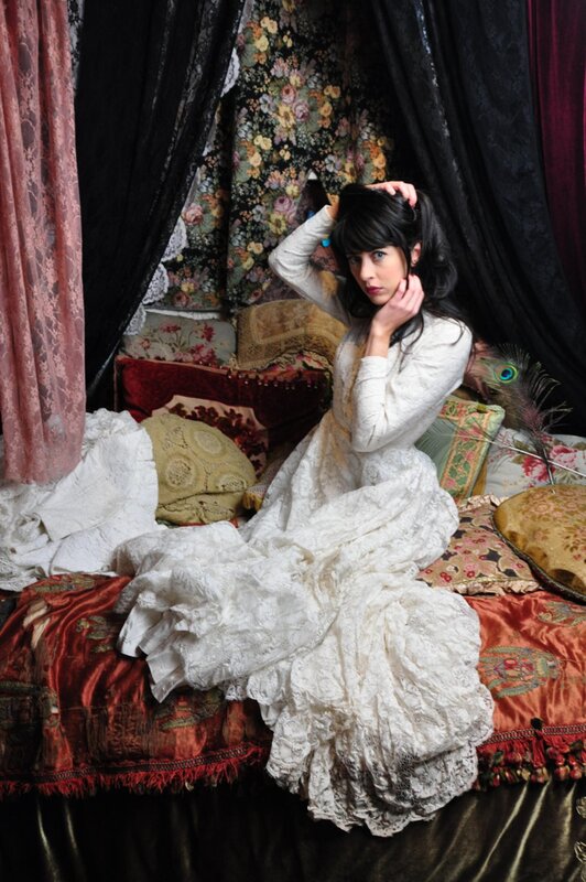 Woman in White Dress — Dramatic, Photograph, Bed, Pillows, Curtains, Red