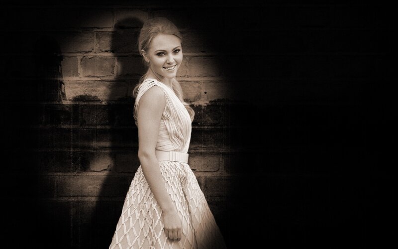 Woman in White Dress — Dramatic, Photograph, Brick Wall, Black