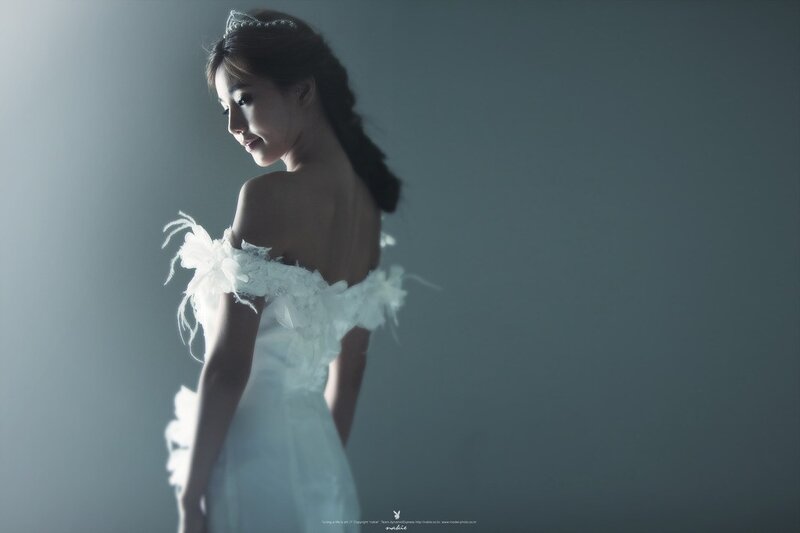 Woman in White Dress — Dramatic, Photograph, Tiara, Feathers
