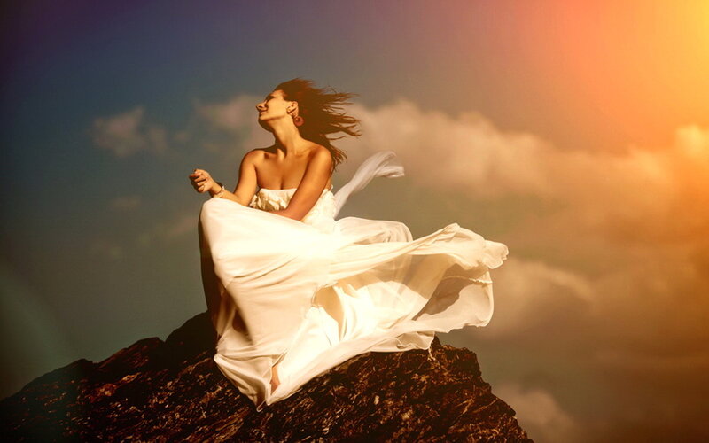 Woman in White Dress — Dramatic, Sunset, Photograph, Rock