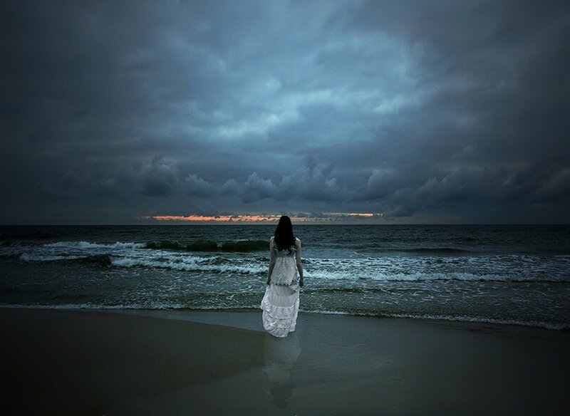 Woman in White Dress — Gray, Dramatic, Sunset, Photograph, Ocean, Clouds