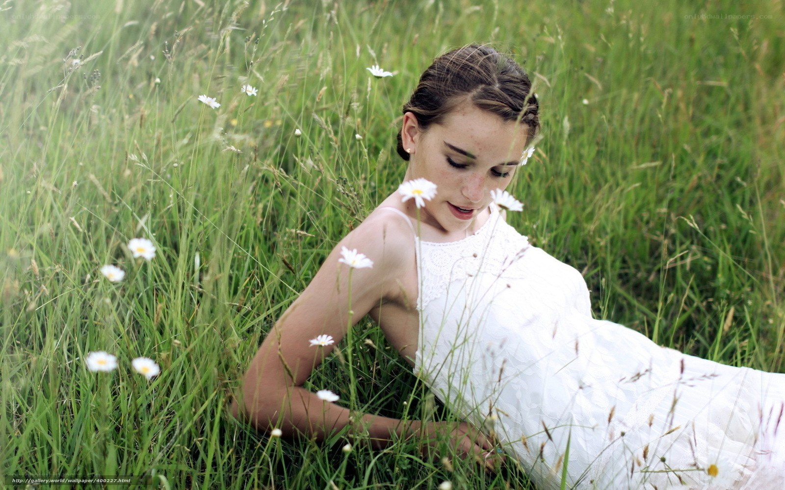 Woman in white dress in a field