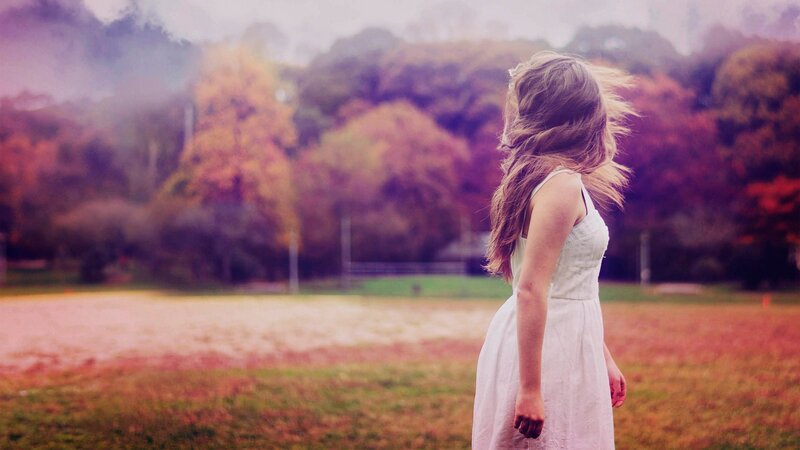 woman in white dress in autumn field