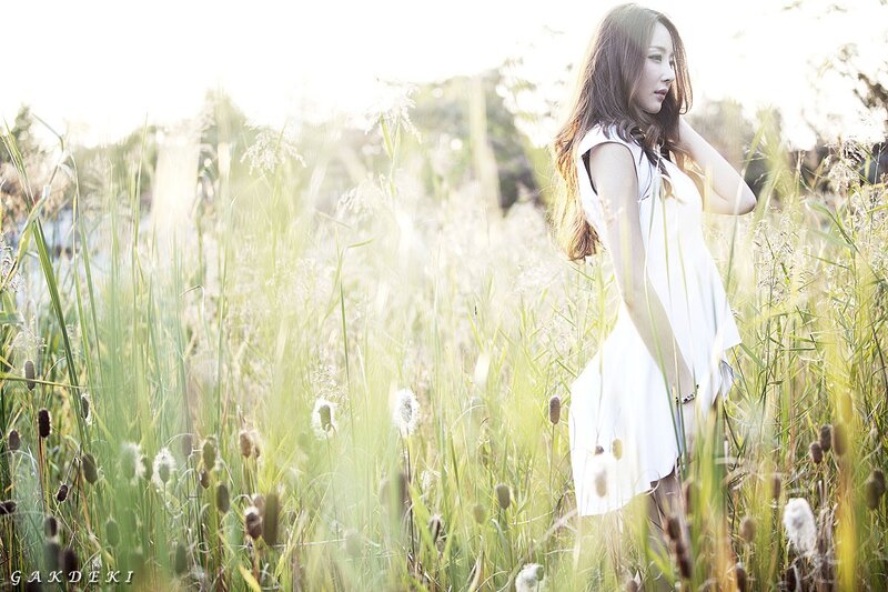 woman in white dress in field