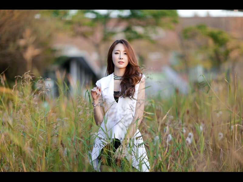 woman in white dress in field