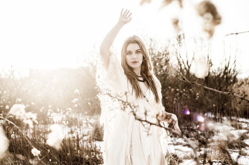woman in white dress in field