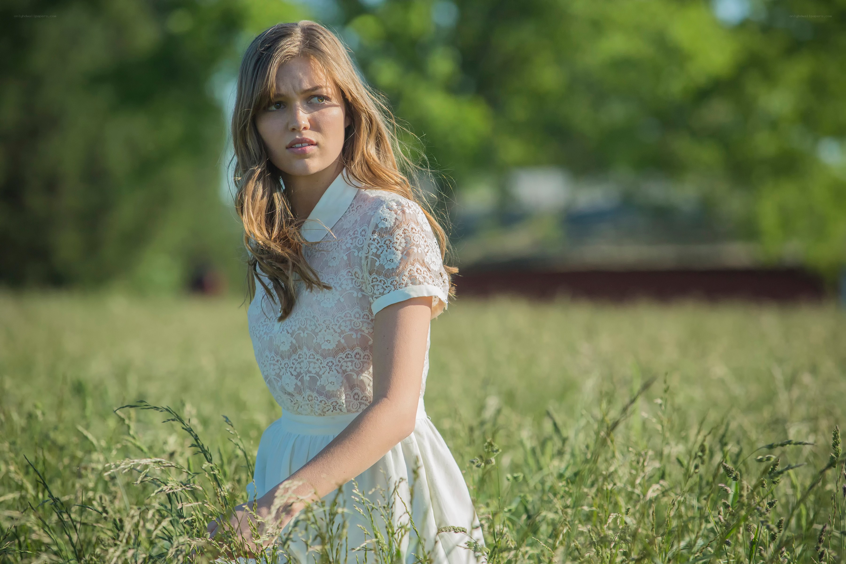 woman in white dress in field