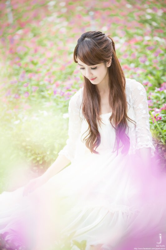 woman in white dress in flower field