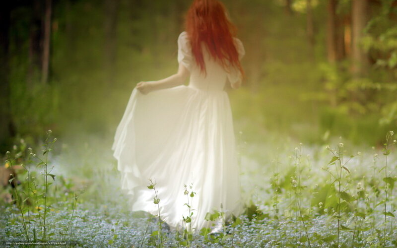 Woman in white dress in forest