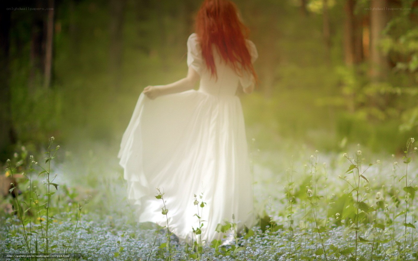 Woman in white dress in forest