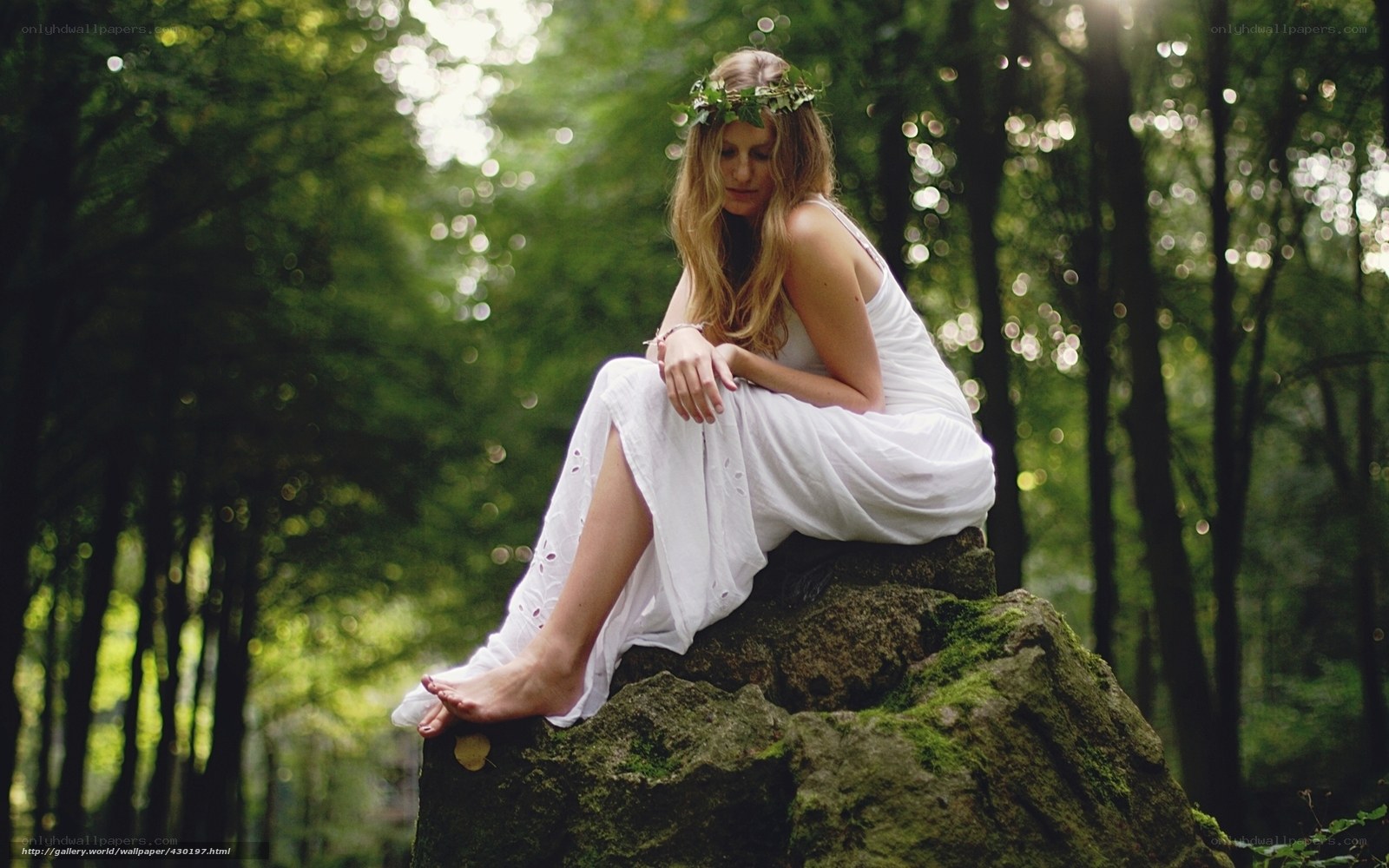 Woman in white dress in forest