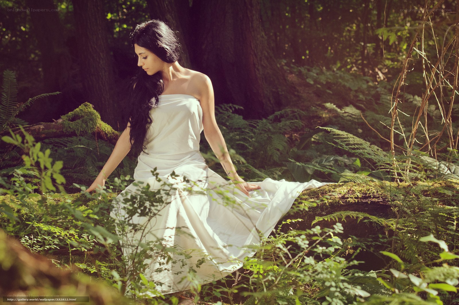 Woman in white dress in forest