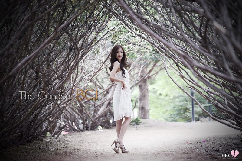 Woman in white dress in garden