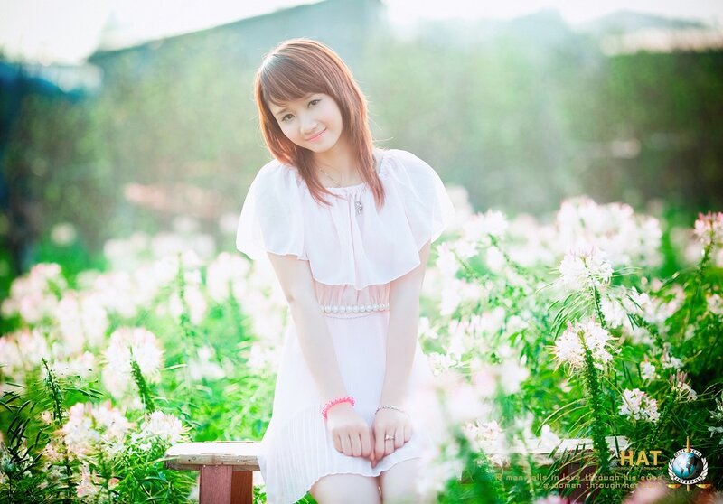 Woman in white dress in garden