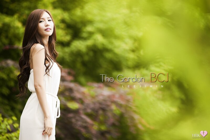 Woman in white dress in garden