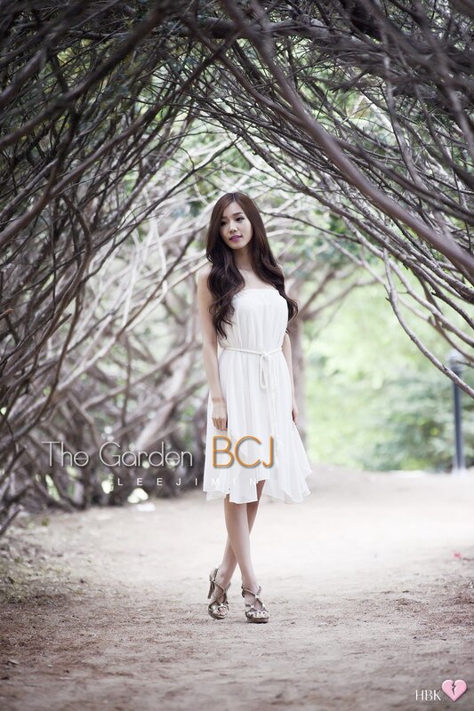 Woman in white dress in garden