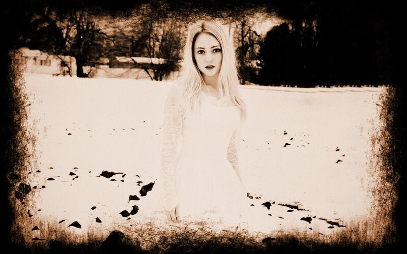 woman in white dress in snowy field