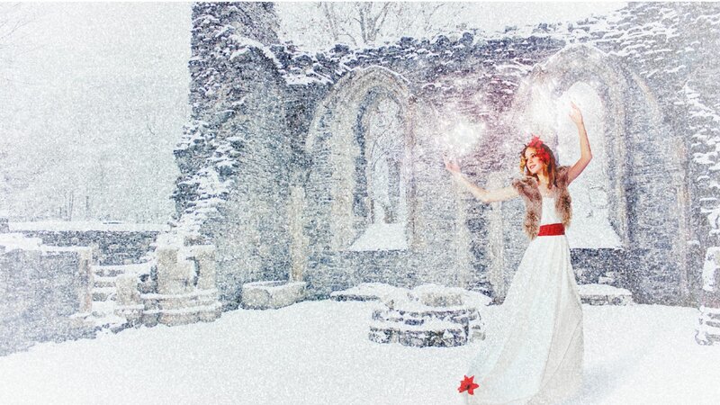 woman in white dress in snowy ruins