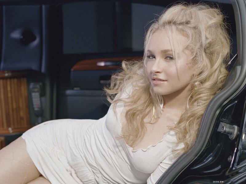 woman in white dress inside car