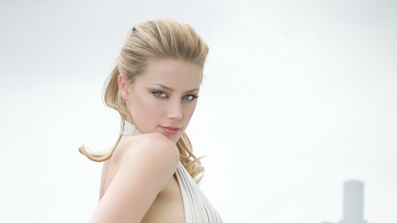 woman in white dress looking back