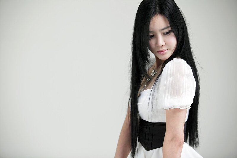 woman in white dress looking down