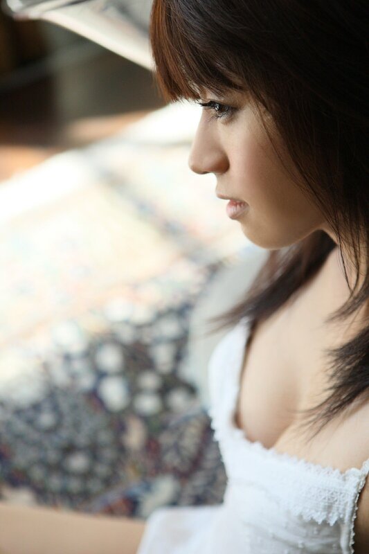 woman in white dress looking down