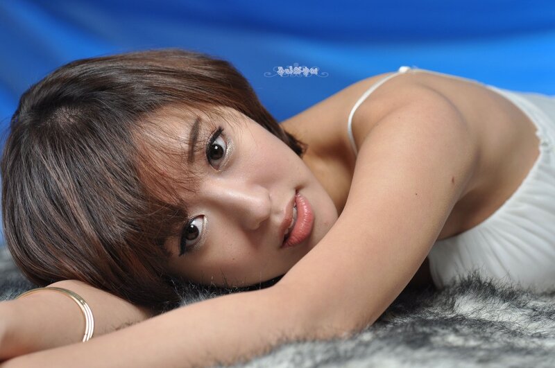woman in white dress lying down