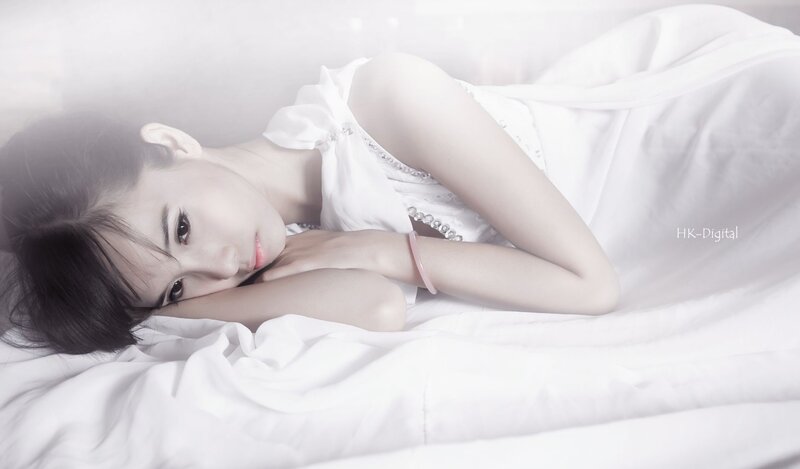 woman in white dress lying down