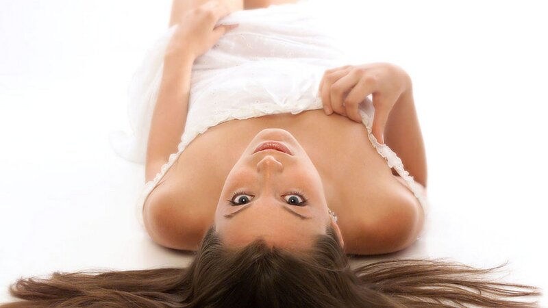 woman in white dress lying down
