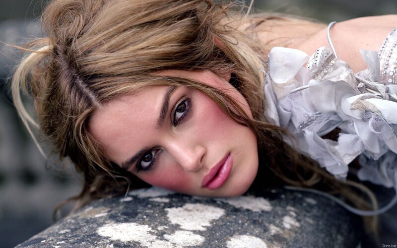 woman in white dress lying down