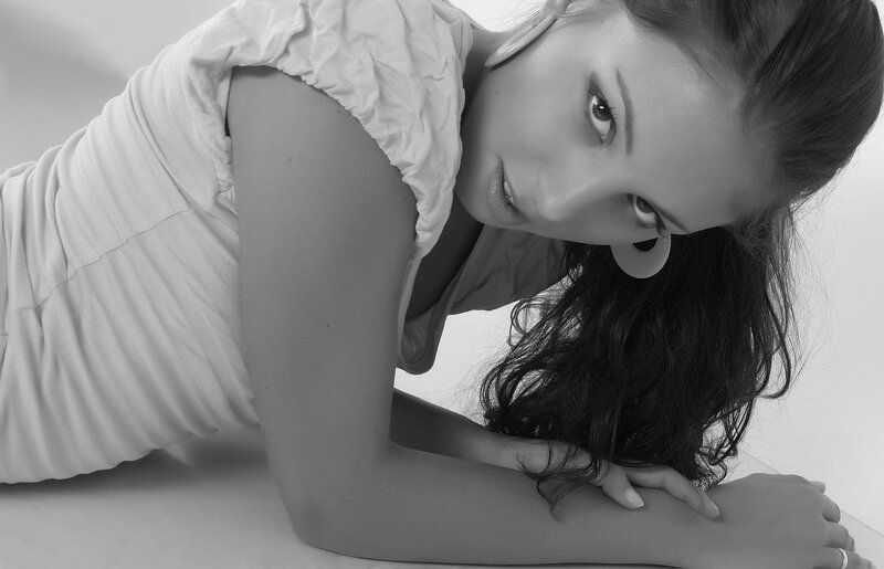 woman in white dress lying down