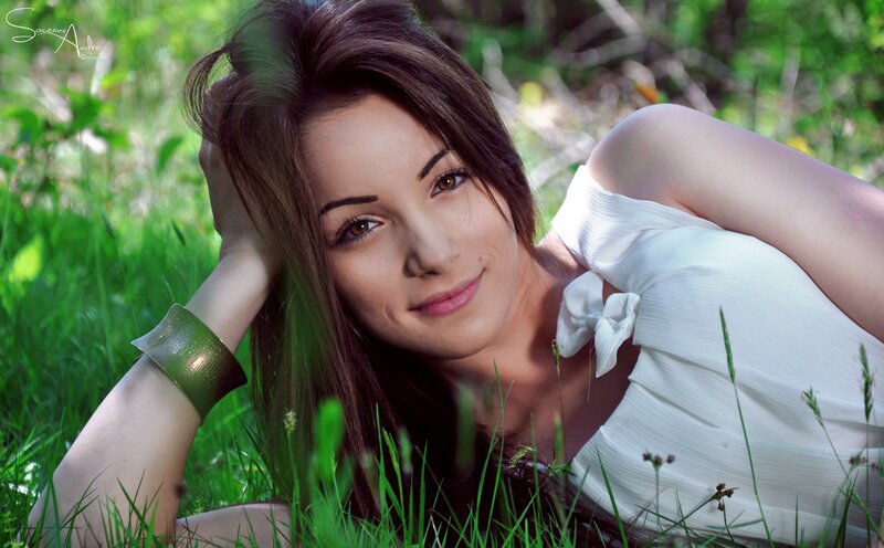 woman in white dress lying on grass