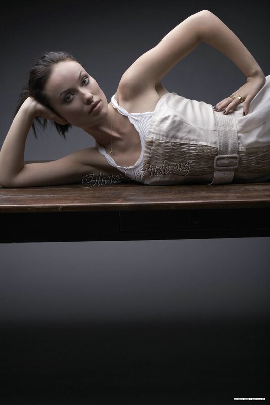 woman in white dress lying on table