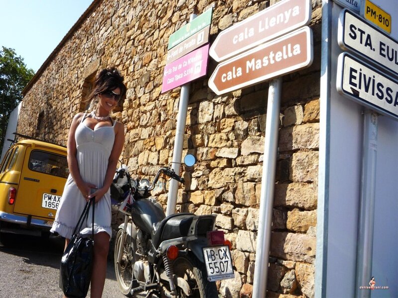 Woman in white dress near motorcycle