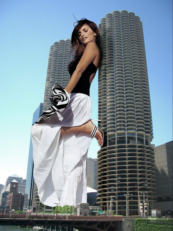Woman in white dress near skyscrapers