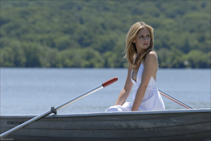 Woman in white dress on a boat