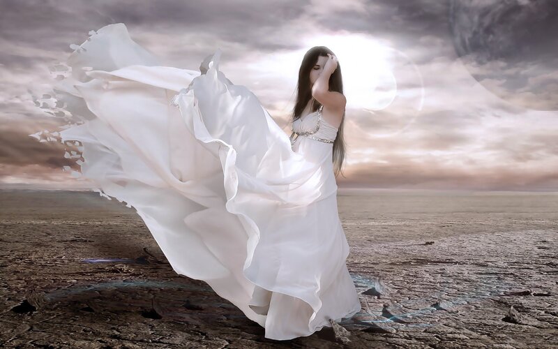 woman in white dress on barren land