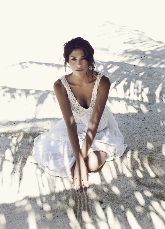 Woman in white dress on beach